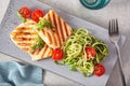 Ketogenic paleo diet lunch. halloumi cheese, spiralized zucchini with arugula pesto and tomatoes