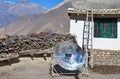 A kettle is boiled using a solar reflector