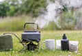 kettle boiling on a camping stove Royalty Free Stock Photo