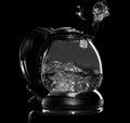 Kettle with boiling water and steam isolated