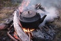 Kettle boils on fire, travel concept, adventure concept, vacation concept, wilderness and travel concept