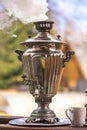 Kettle on firewood in Russian traditions. Samovar.