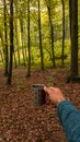 A kettle with natural herbal tea outside in nature near the fire. Living a healthy life close to nature Royalty Free Stock Photo