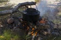 Kettle over campfire