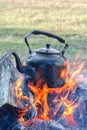 The kettle stands on an open fire, outdoor recreation