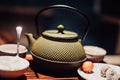 kettle and two small bowls on wooden table Royalty Free Stock Photo