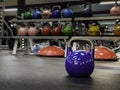 Kettlebell at a gym with more colorful kettlebells on the background