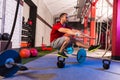 Kettlebell man pistol squat balance at gym