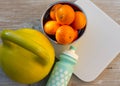 Kettlebell, tangerines, scales and bottle of water Royalty Free Stock Photo
