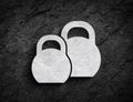 Kettlebell weights symbol stone wall background