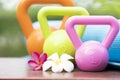 Kettlebell, yoga mat and flower on the table Royalty Free Stock Photo