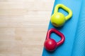 Kettlebell and yoga mat on table Royalty Free Stock Photo