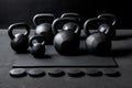 Kettlebells and dumbbells with black plates on floor on black mats background. Generative Ai