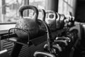 Kettlebells in a rack at the gym. Free weights close up. Royalty Free Stock Photo