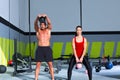 Kettlebells swing crossfit exercise man and woman