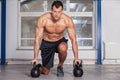 Kettlebells training crossfit - man in a gym