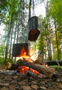 Kettles on fire in wood Royalty Free Stock Photo