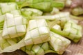 Ketupat casing in bamboo container. traditional malay delicacy d