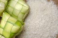 Ketupat casing and rice in bamboo container. traditional malay delicacy during Malaysian eid festival Royalty Free Stock Photo