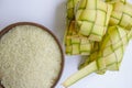 ketupat in earthenware plate isolated on white background. Ketupat Rice Dumpling is food served when idhul fitri eid mubarak. Royalty Free Stock Photo