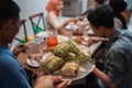 Ketupat with people eating on the background