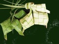 Ketupat or rice dumpling is a local delicacy during the festive season. Ketupats, a natural rice casing made of coconut leaves. Royalty Free Stock Photo