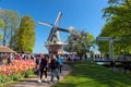 Keukenhof, The Netherlands - May, 2018: Blooming colorful tulips flowerbed in public flower garden Keukenhof with windmill. Popula Royalty Free Stock Photo