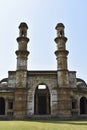 Kevda Masjid with two minarets, built in stone and carvings details of architecture, an Islamic monument was built by Sultan Royalty Free Stock Photo