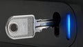 Key Accessing a Secure Lock with Blue Light Royalty Free Stock Photo
