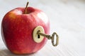 Key and apple, key to health. Healthy eating concept Royalty Free Stock Photo