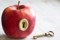 Key and apple, key to health. Healthy eating concept Royalty Free Stock Photo