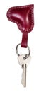 Key on burgundy leather heart shaped key ring Royalty Free Stock Photo