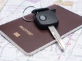 Key from the car and passport on map. Royalty Free Stock Photo