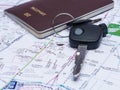 Key from the car and passport on map. Royalty Free Stock Photo