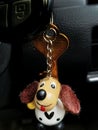 Key chain of a car in the figure of a cute dog