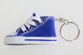 Key chain with mini basketball shoe miniature sneakers blue shoes keychain Royalty Free Stock Photo