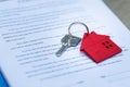 Key chain red house. The real estate agent is handing over the keys to the customer. Mortgage concepts. Rent, purchase and Royalty Free Stock Photo