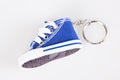 Key chain vintage with mini blue basketball shoe miniature sneaker shoes keychain Royalty Free Stock Photo