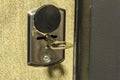 Key in the door hole, close-up. Modern metal key