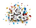 Key facts sign over colorful cut out foil ribbon confetti background