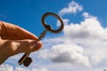 Key into hand, Sky Background Royalty Free Stock Photo