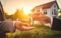 Key handover scene where the real estate agent or landlord hands over the keys to a new house owner, tenant, or property investor Royalty Free Stock Photo