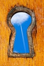 Key hole with blue sky