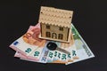 Key and house model on euro banknotes Royalty Free Stock Photo