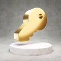 Key icon. Shiny golden Key symbol on white marble podium Royalty Free Stock Photo