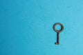 Key isolated on blue background Royalty Free Stock Photo