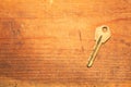 Key isolated on a wooden background. safety and security concept