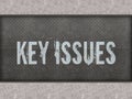 KEY ISSUES painted on metal panel wall. Royalty Free Stock Photo
