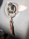 Key with a key fob in the ignition lock of a passenger car. Royalty Free Stock Photo