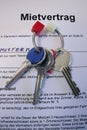 Key and lease or rental agreement in german Mietvertrag